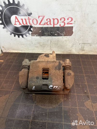 Суппорт передний левый Kia Spectra