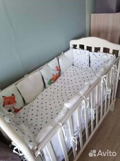 Детская кроватка с продольным маятником