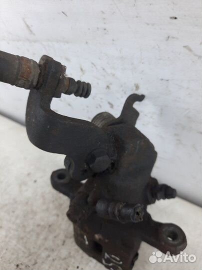 Суппорт тормозной задний левый Kia Cerato хэтчбэк