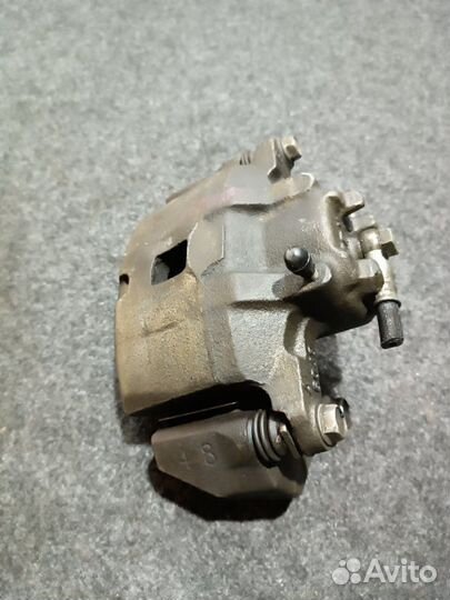 Суппорт тормозной передний левый Mitsubishi Lancer