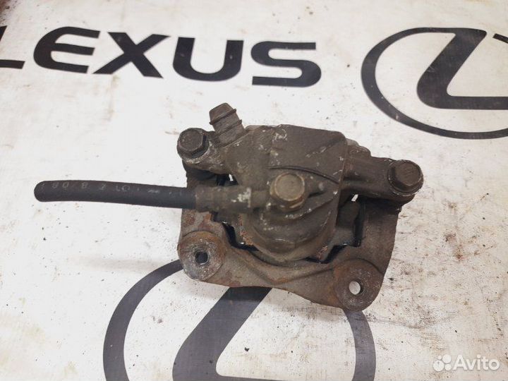 Суппорт тормозной задний правый Toyota Camry ACV40