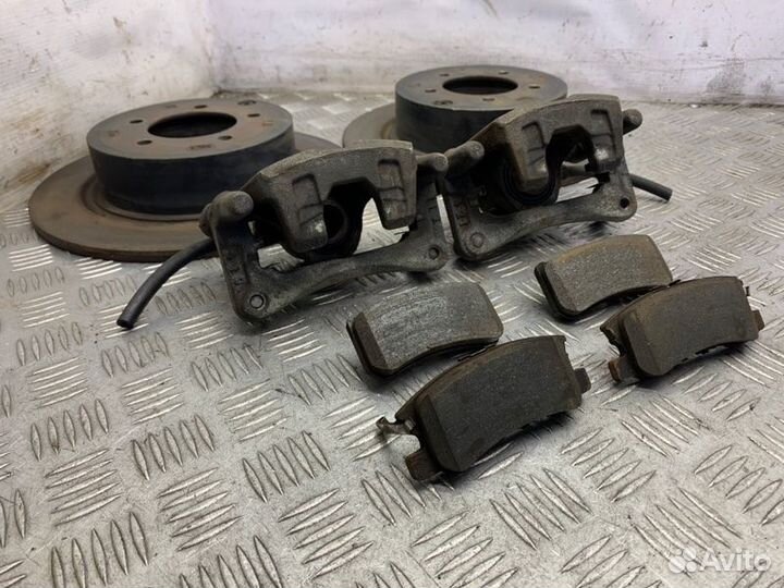 Суппорт тормозной задний Mitsubishi Lancer 10 4B11