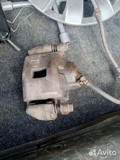 Суппорт передний левый kia spectra