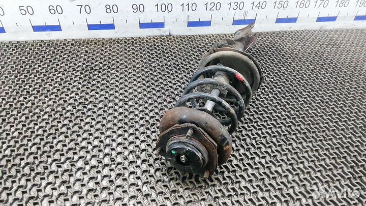 Стойка амортизатора заднего левого Nissan X-Trail