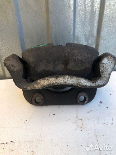 Суппорт тормозной передний левый Renault Logan