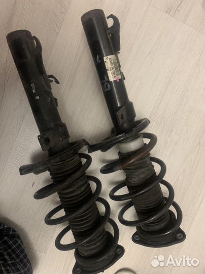 Стойки амартизатора на Мазду 3 в сборе