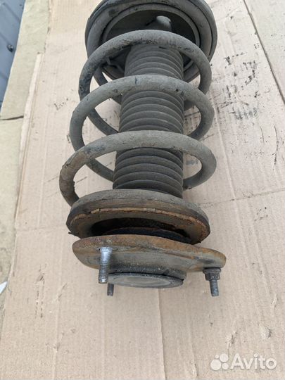 Geely Emgrand EC7 Стойка амортизатора передние