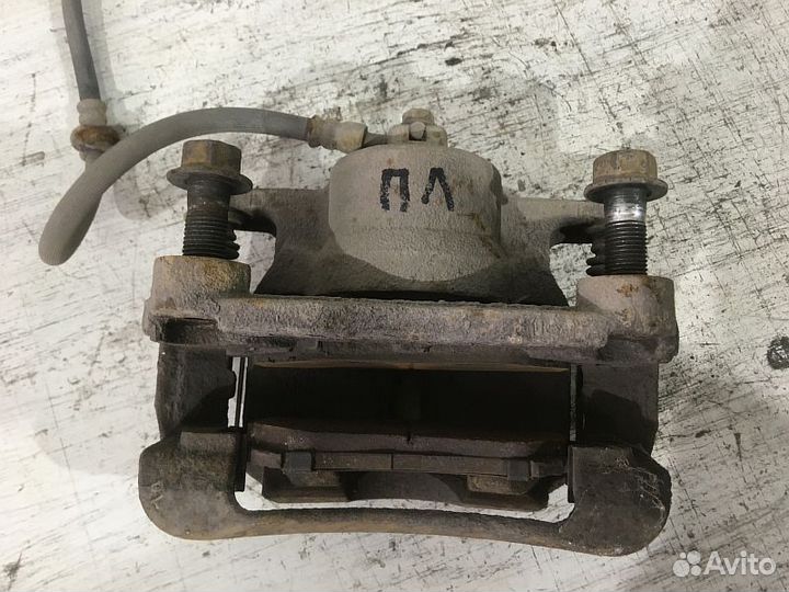 Суппорт тормозной передний левый Nissan Кашкай