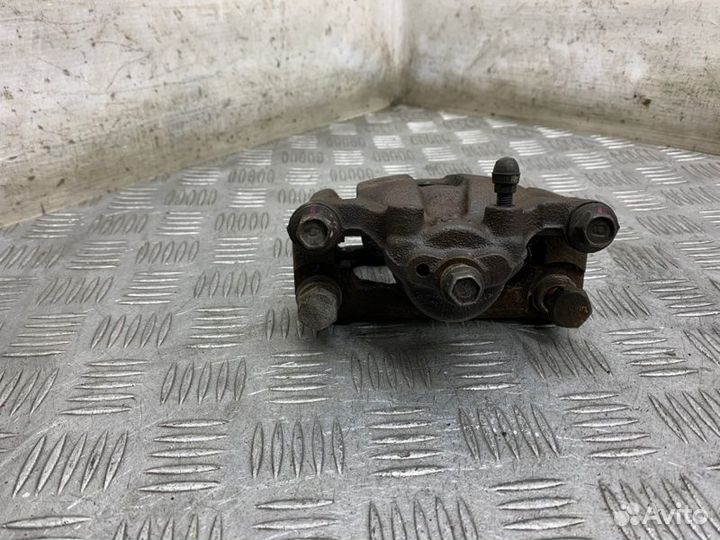 Суппорт тормозной задний левый Nissan X-Trail T30