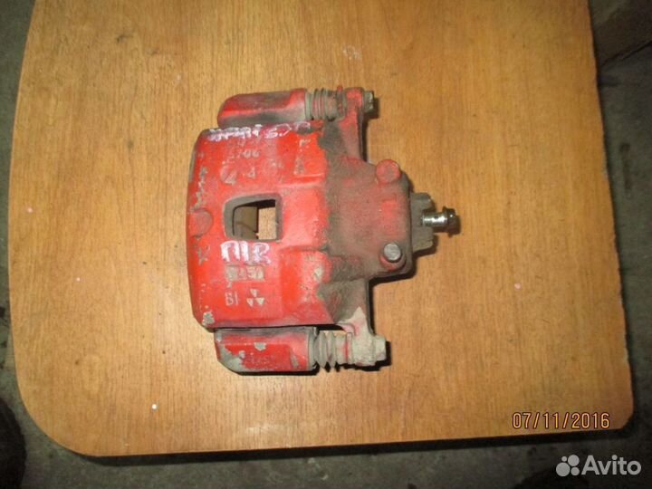 Суппорт передний правый Субару Импреза 26292AE141