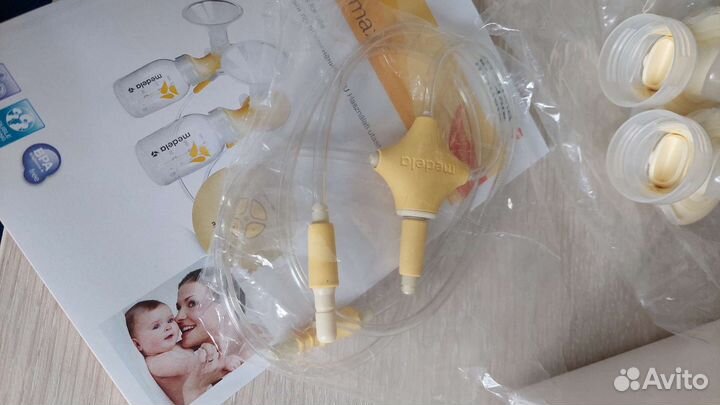 Молокоотсос Medela Swing Maxi + смартсоска Calma