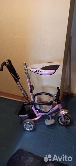 Трехколесный велосипед с ручкой