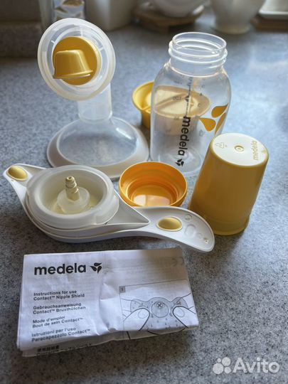 Молокоотсос medela ручной и пакеты в подарок