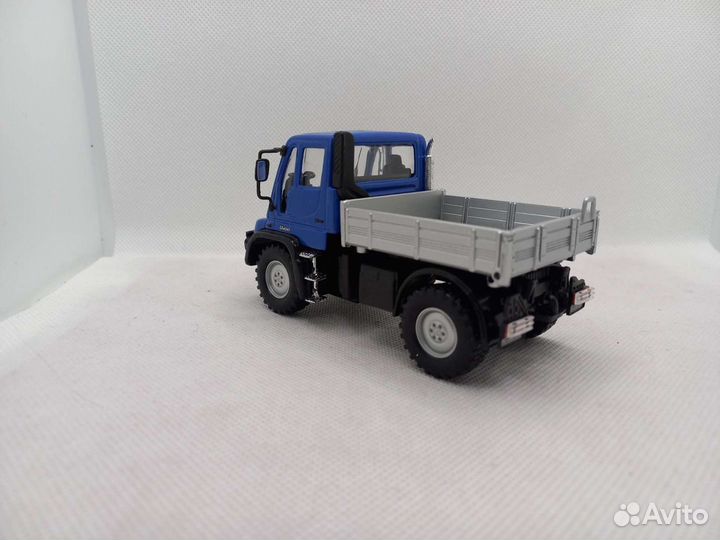 Mercedes Unimog U400,бортовой 1:43 Welly
