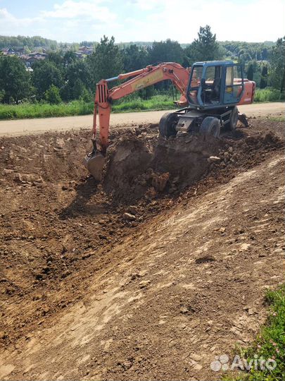 Услуги экскаватора колесного полноповоротного