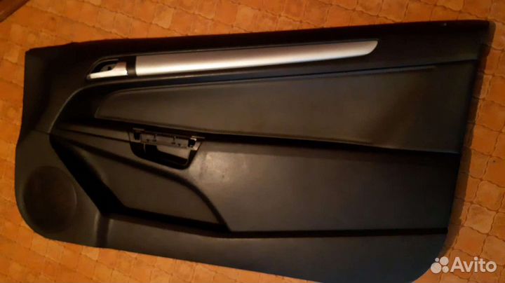 Обшивка двери Opel Astra h gtc