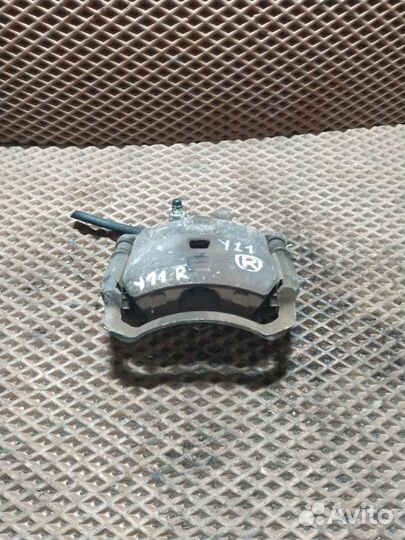 Суппорт тормозной передний правый Nissan Wingroad