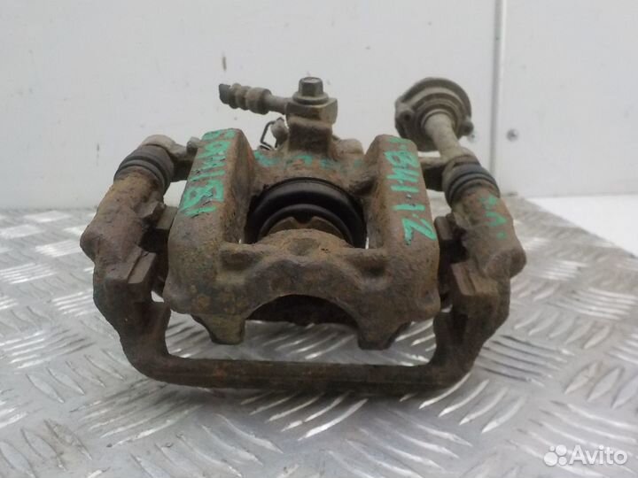 Суппорт тормозной задний левый Opel Astra J 2010