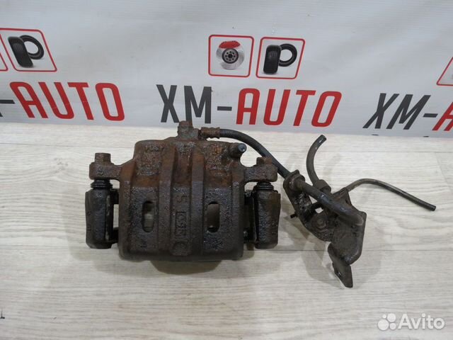 Суппорт тормозной передний Mitsubishi Outlander XL