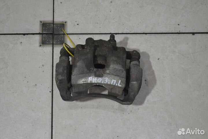 Тормозной суппорт передний левый Kia Rio 3