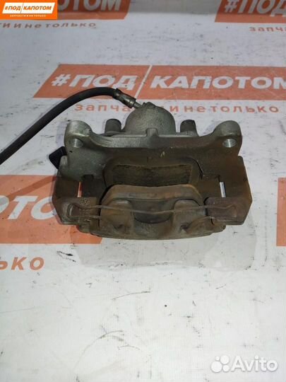 Суппорт тормозной передний левый Volkswagen Passat