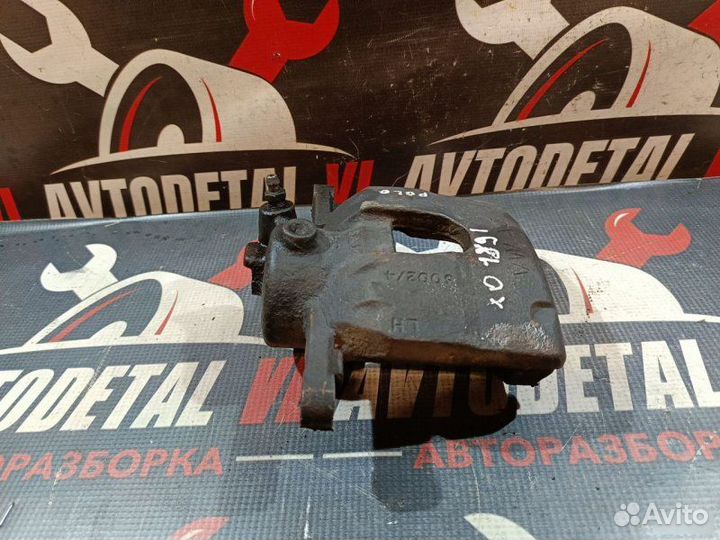 Суппорт тормозной передний Volkswagen Polo