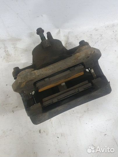 Суппорт тормозной передний левый Nissan Almera N16