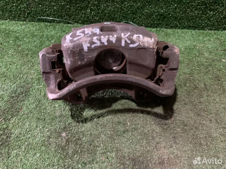 Суппорт тормозной передний левый Nissan Cefiro