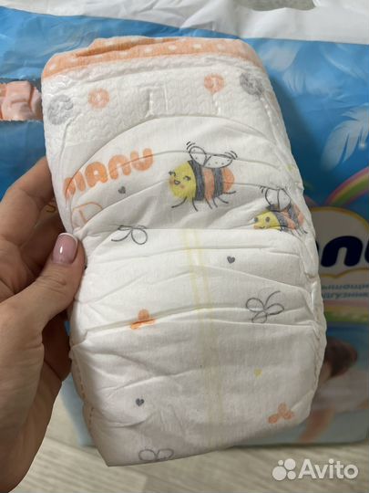 Новая целая пачка подгузников manu L