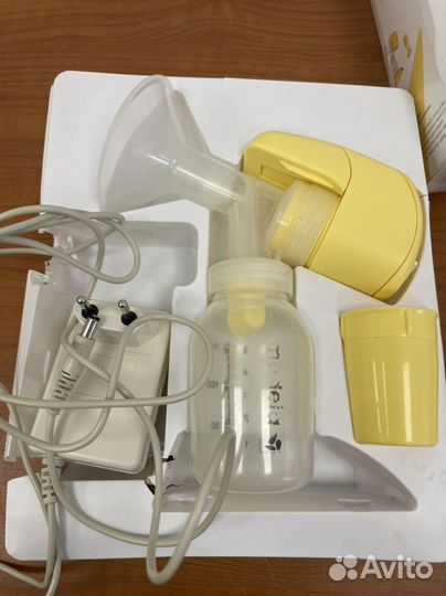 Молокоотсос medela электрический