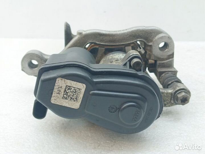 Суппорт тормозной задний левый Nissan Qashqai J11