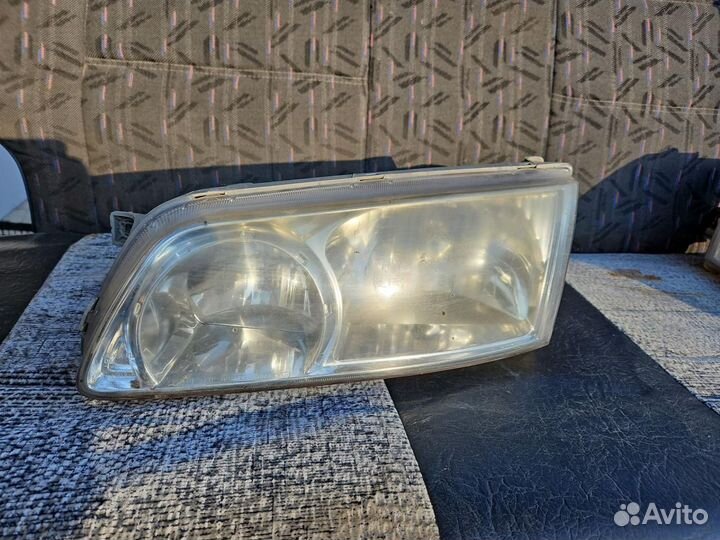 Фара левая Hyundai H-1 Starex рест. 2003