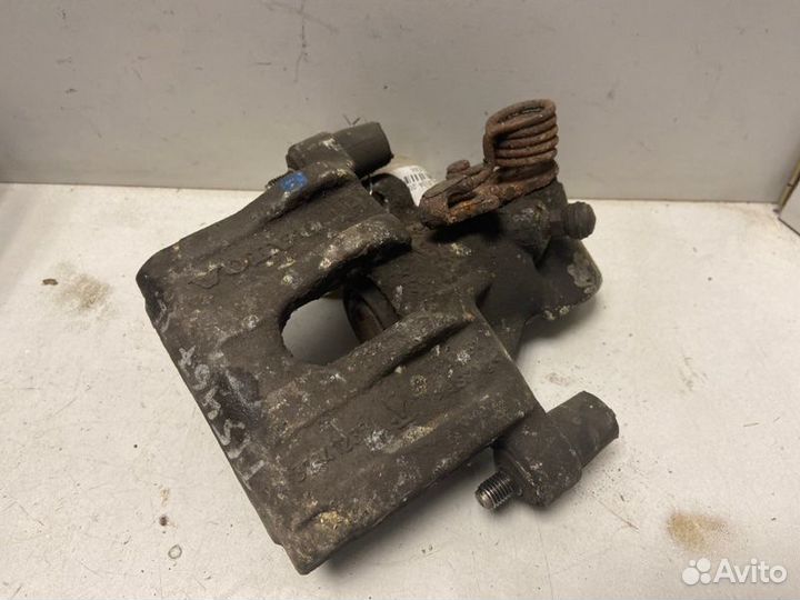 Суппорт тормозной задний левый Ford Focus Ii