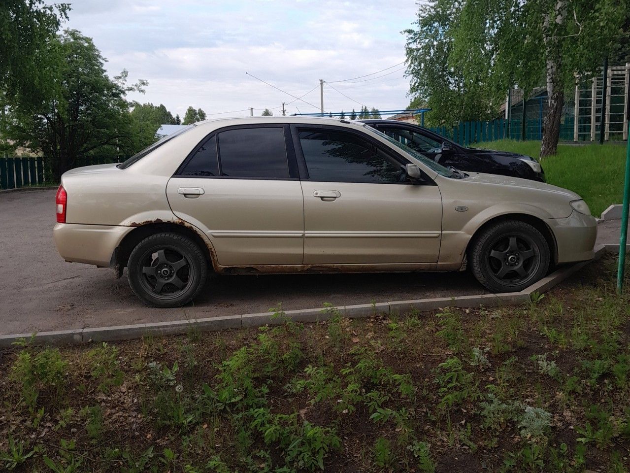 Mazda Familia: фото владельца