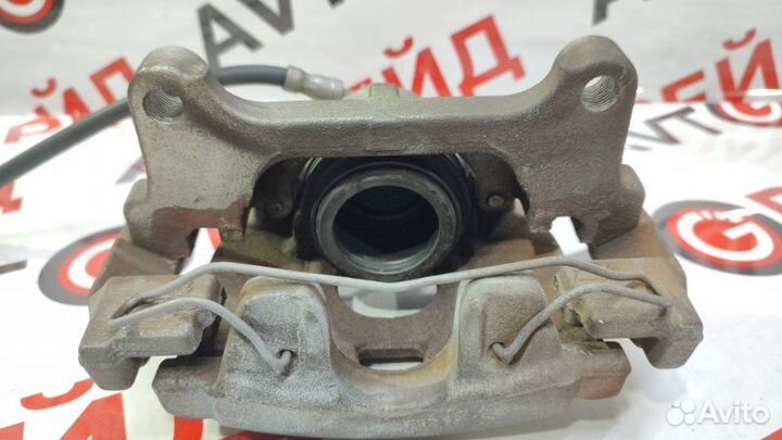 Суппорт тормозной передний левый Volkswagen Tiguan