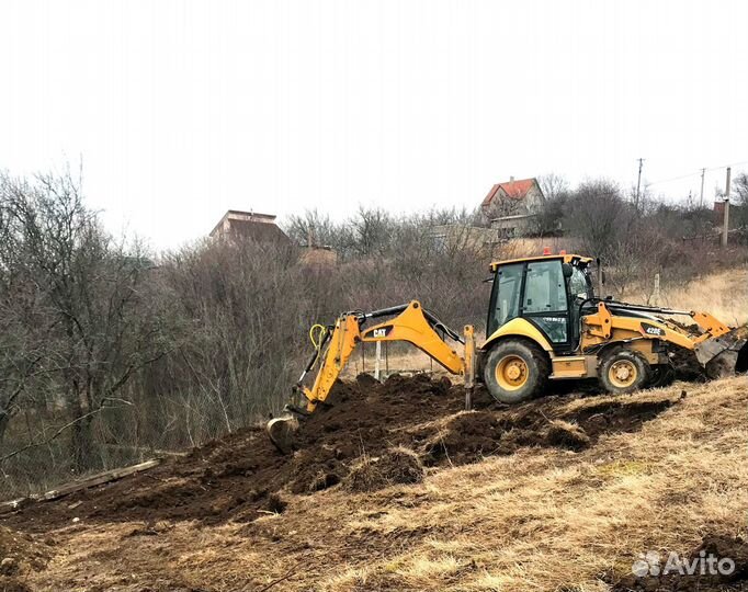 Экскаватор погрузчик в Симферополе с гидромолотом