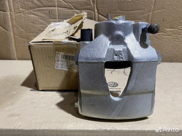 Суппорт тормозной передний левый VAG Новый