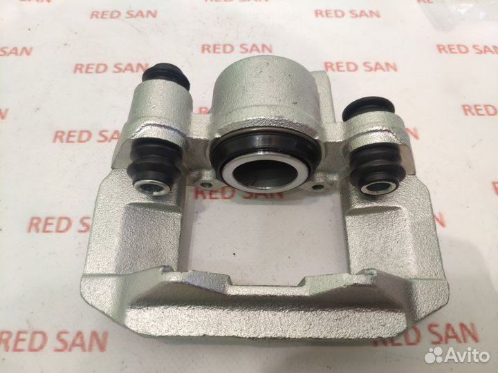 Суппорт тормозной задний левый Mitsubishi Pajero