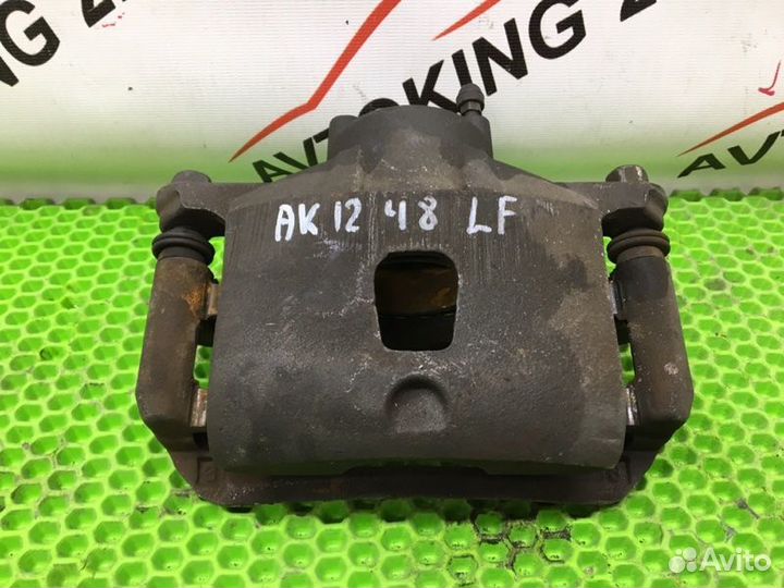 Суппорт тормозной передний левый Nissan March AK12