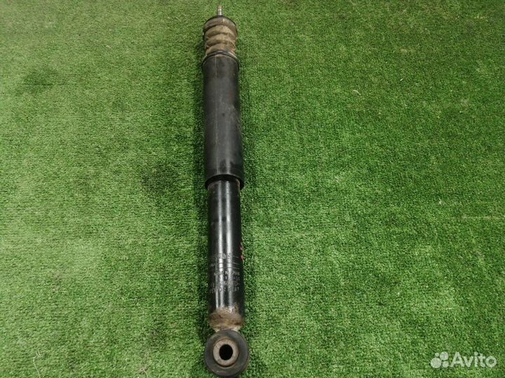 Амортизатор задний левый Nissan Micra K12E CR12DE