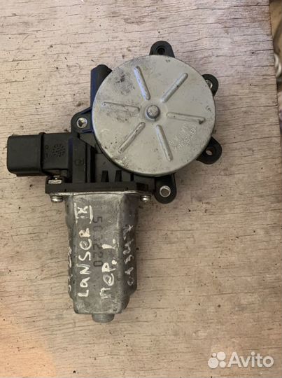 Моторчик стеклоподъемника левый Лансер 9