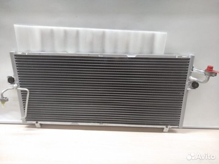 Радиатор кондиционера Nissan Primera 921109F515