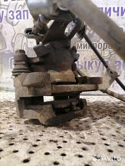 Суппорт тормозной задний левый Mitsubishi Outlande