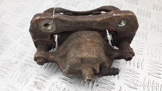 Суппорт тормозной передний левый KIA carens 2 (10V