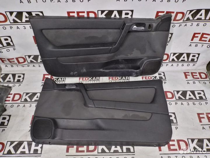 Обшивка боковой двери передняя левая Opel Astra G