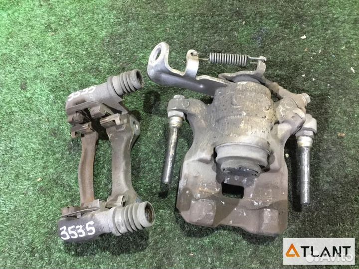 Суппорт задний правый mazda axela