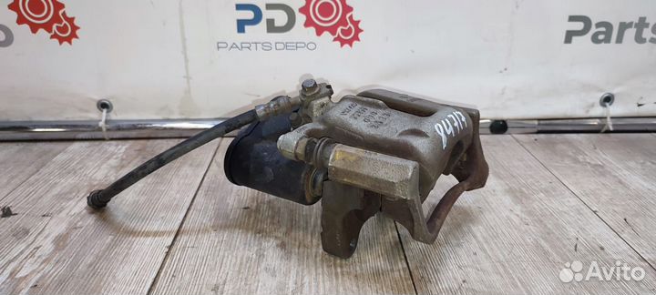 Суппорт тормозной задний левый Volkswagen