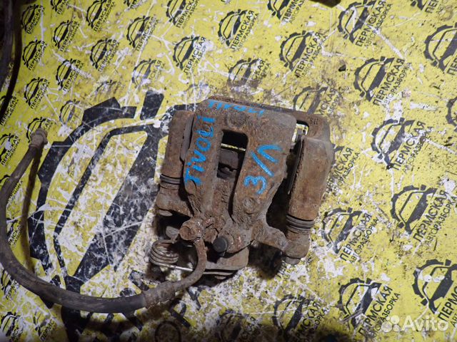 Суппорт тормозной задний левый SsangYong Tivoli