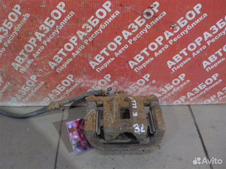 Суппорт тормозной задний левый Chevrolet Lacetti