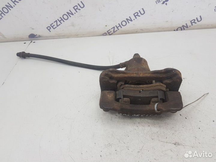 Суппорт тормозной задний левый Kia Sportage